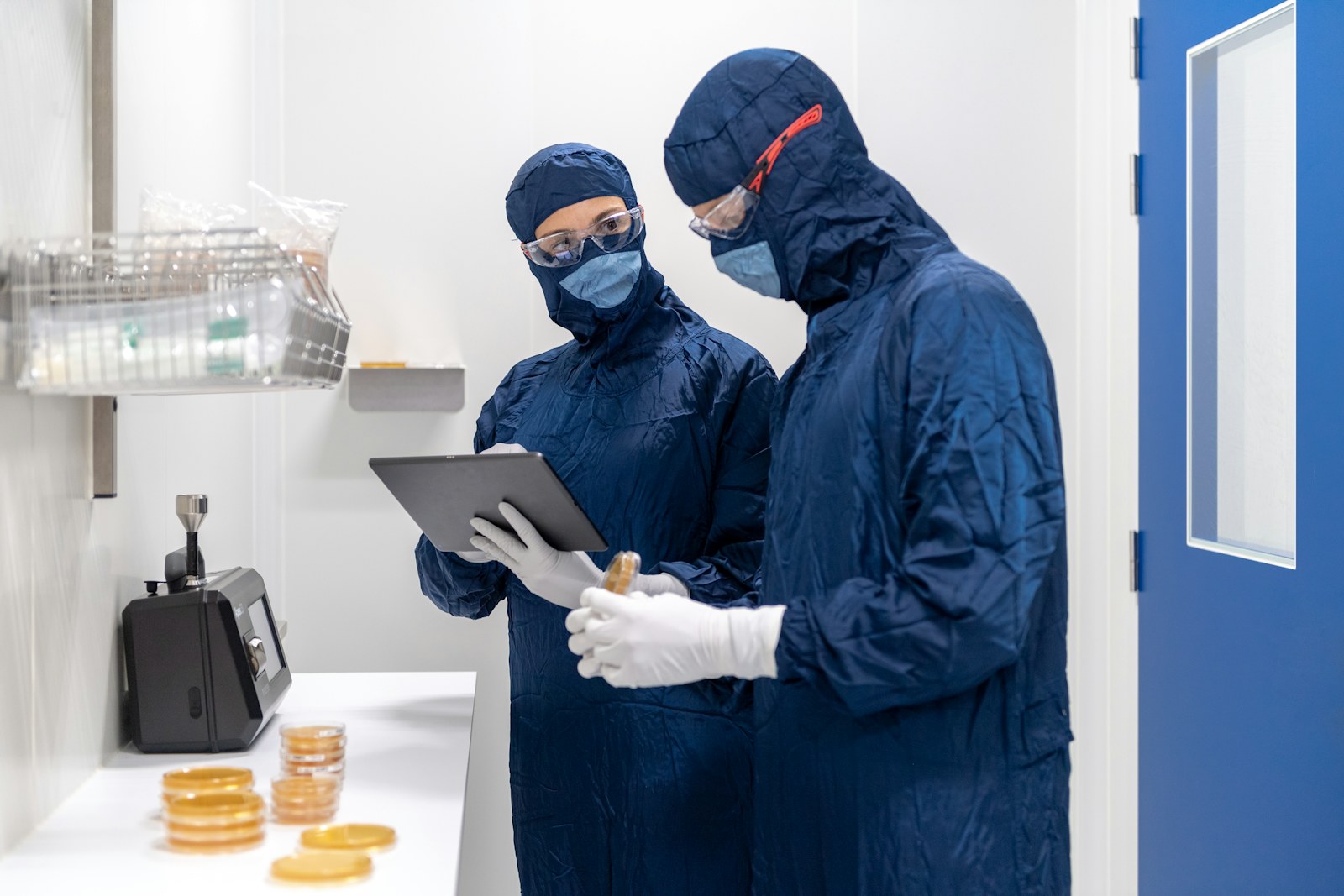 Pharmaceutical scientist operating precision laboratory equipment